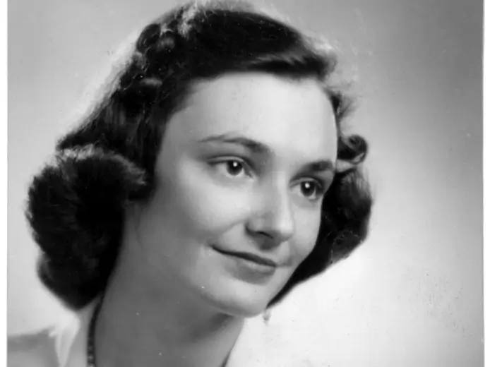 Black and white portrait of young Helen Daniels Bader, a woman with dark, styled hair and a subtle smile.
