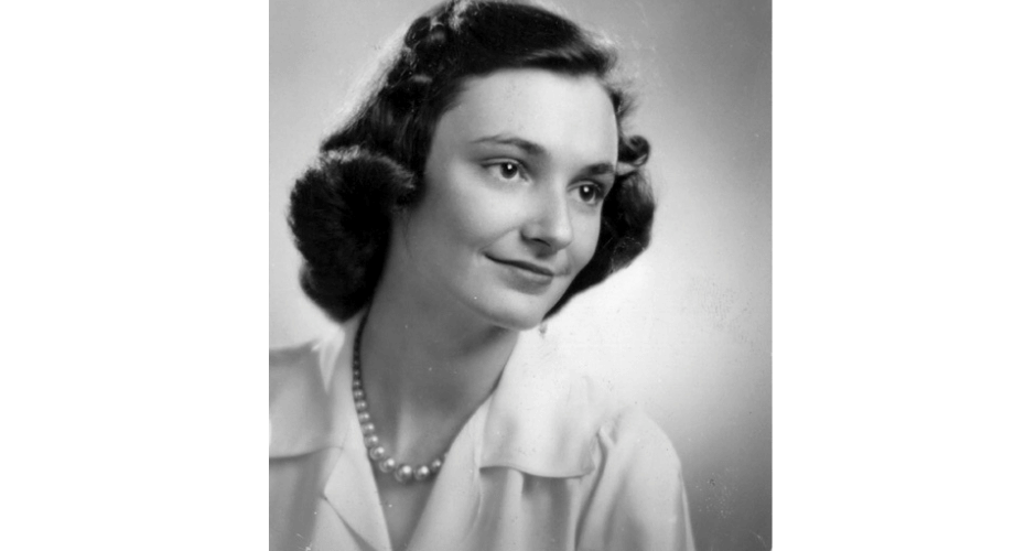 Black and white vintage portrait of a smiling young woman with dark curled hair, wearing pearls. Associated with JMM Event.