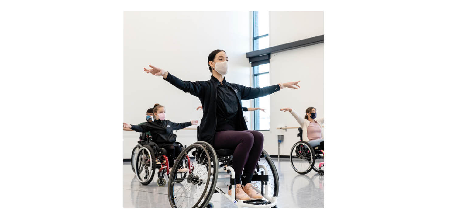 Wheelchair Dance Class: Adaptive Ballet Performance Adaptive dance class with masked wheelchair users practicing ballet arm positions in a bright studio.