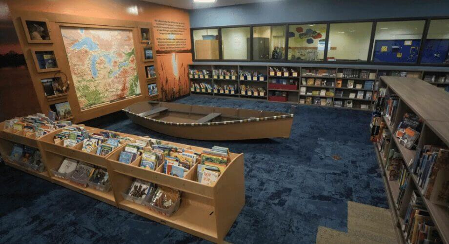 Great Lakes Themed Children’s Library & Learning Space Vibrant children's library with Great Lakes map, display boat, and shelves stocked with engaging educational books.