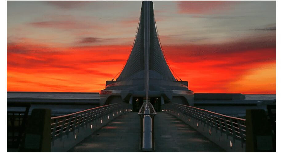 Milwaukee Art Museum Quadracci Pavilion Sunset Milwaukee Art Museum Quadracci Pavilion at dramatic sunset, modern architecture, Santiago Calatrava design, vibrant sky.