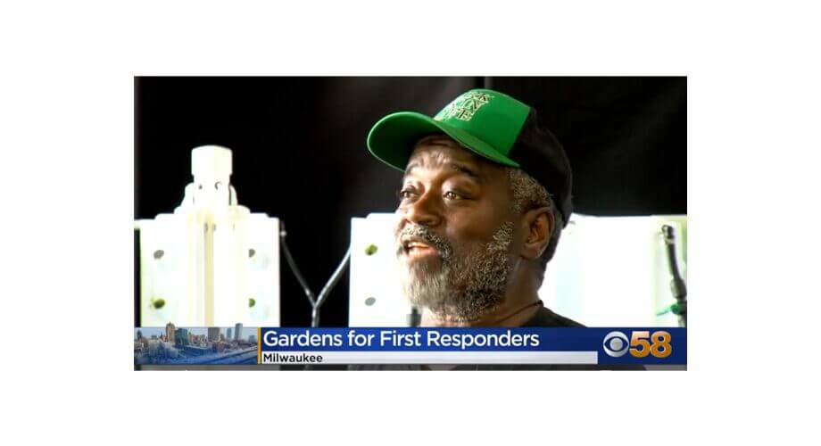 Milwaukee Man Discusses First Responder Gardens Community leader discussing Milwaukee's Gardens for First Responders initiative on local news broadcast.