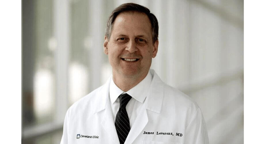 Smiling Dr. James Leverenz, MD, Cleveland Clinic physician in white lab coat and striped tie.