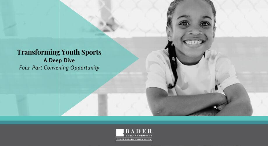 Smiling child, part of Bader Philanthropies' Transforming Youth Sports program for development.