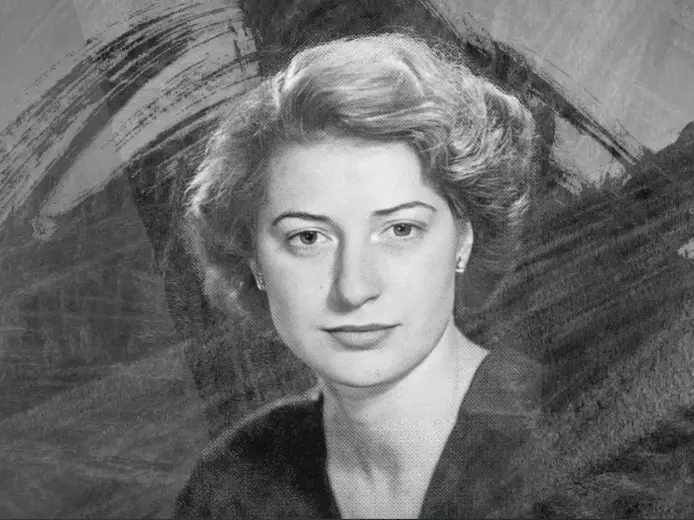 Formal black and white portrait of Isabel Bader, philanthropist and arts patron, with an artistic background.