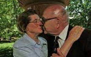 Isabel and her partner share a tender kiss outdoors in 1982. A nostalgic moment from their personal timeline.