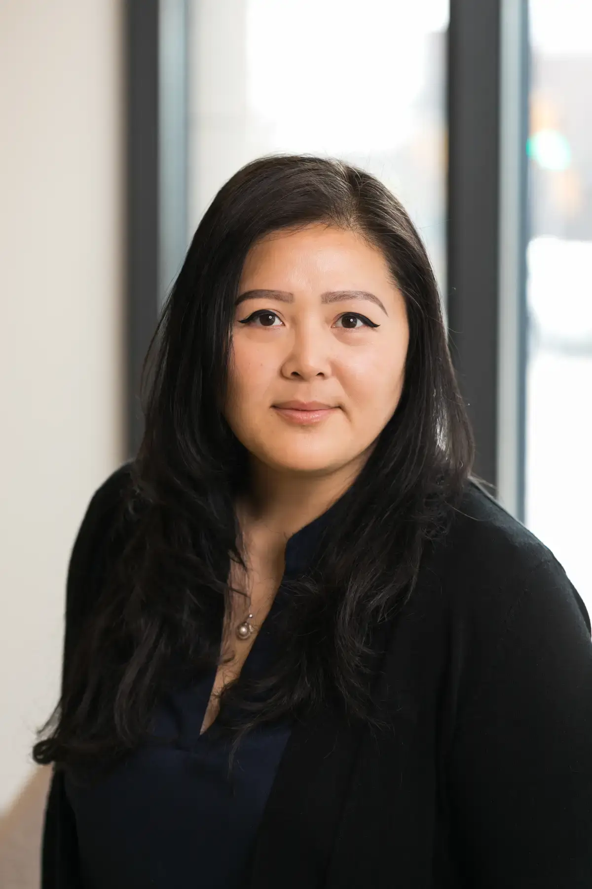 Professional headshot of Kim Thanh Thao, CP, MBA. Asian woman in business attire, smiling gently.
