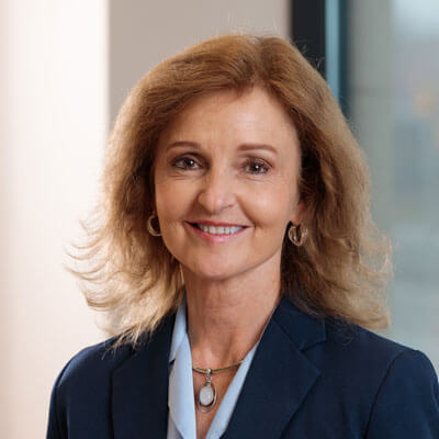 Headshot of Samantha Maldonado. Woman with long curly hair.